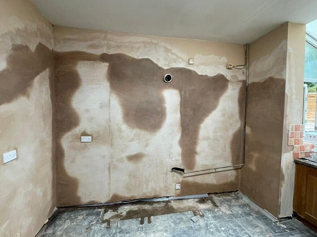 Replastered wall after damp proofing in Blackburn