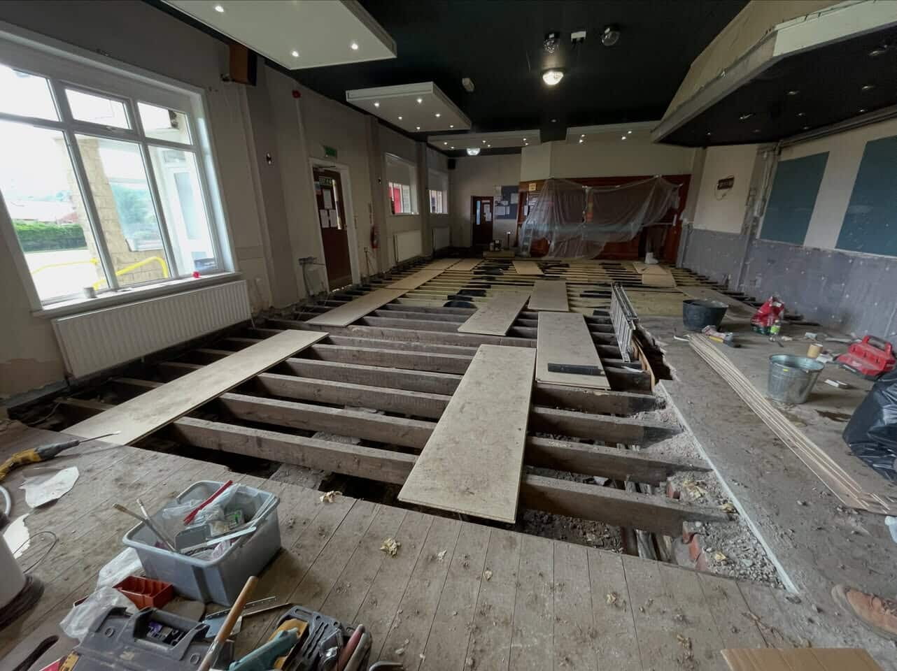 Dry rot repair to the function room floor at Darwen Bowling Club. New joists