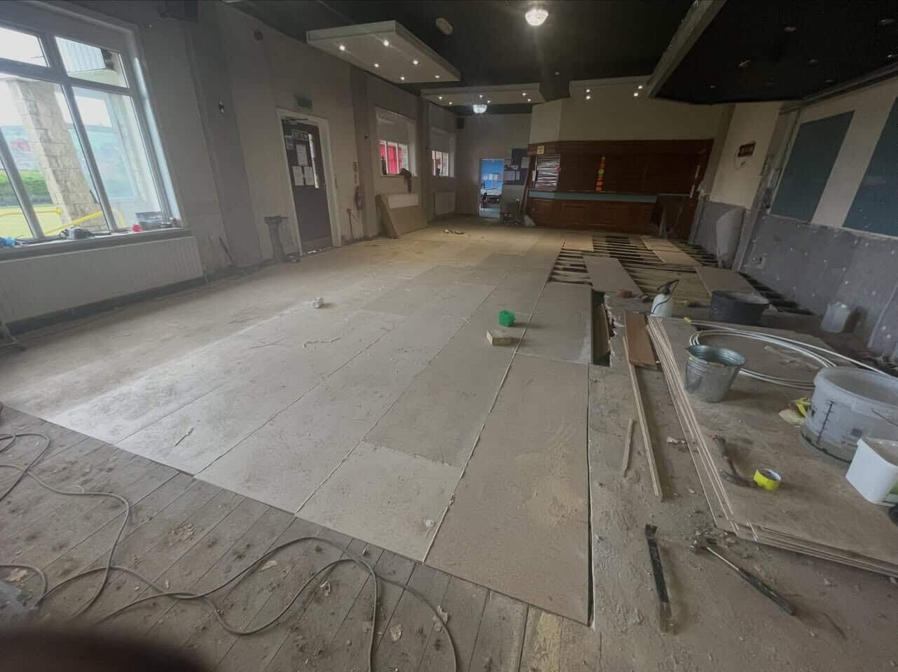 Dry rot repair to the function room floor at Darwen Bowling Club. reinstating the floor