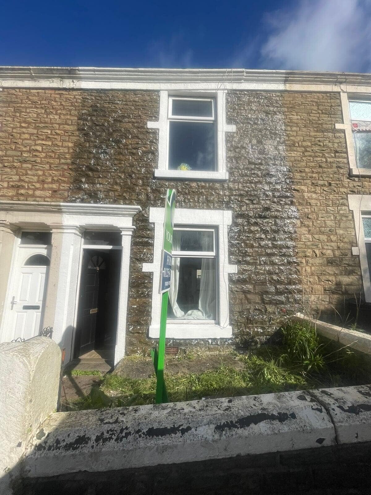 Damp proof treatment to the front of a stone terraced house in Darwen