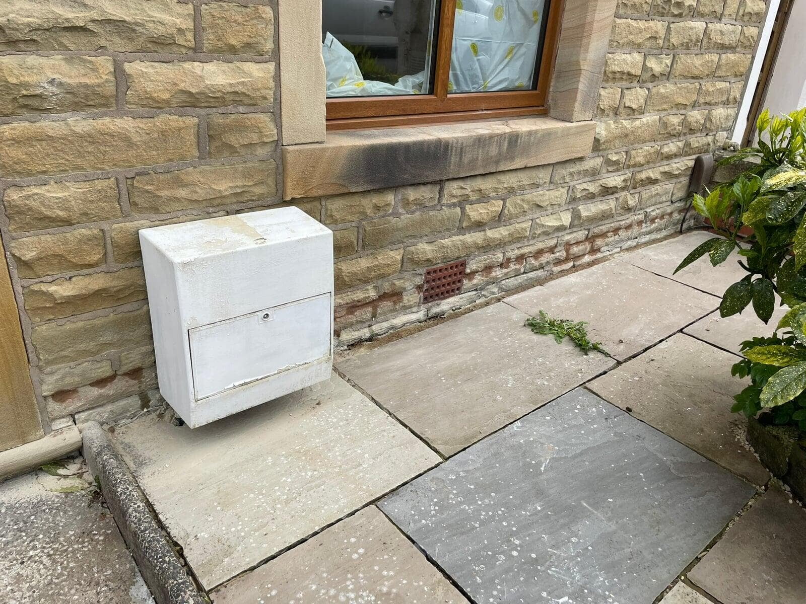 Damp Proof Course at brick and stone house front in Great Harwood