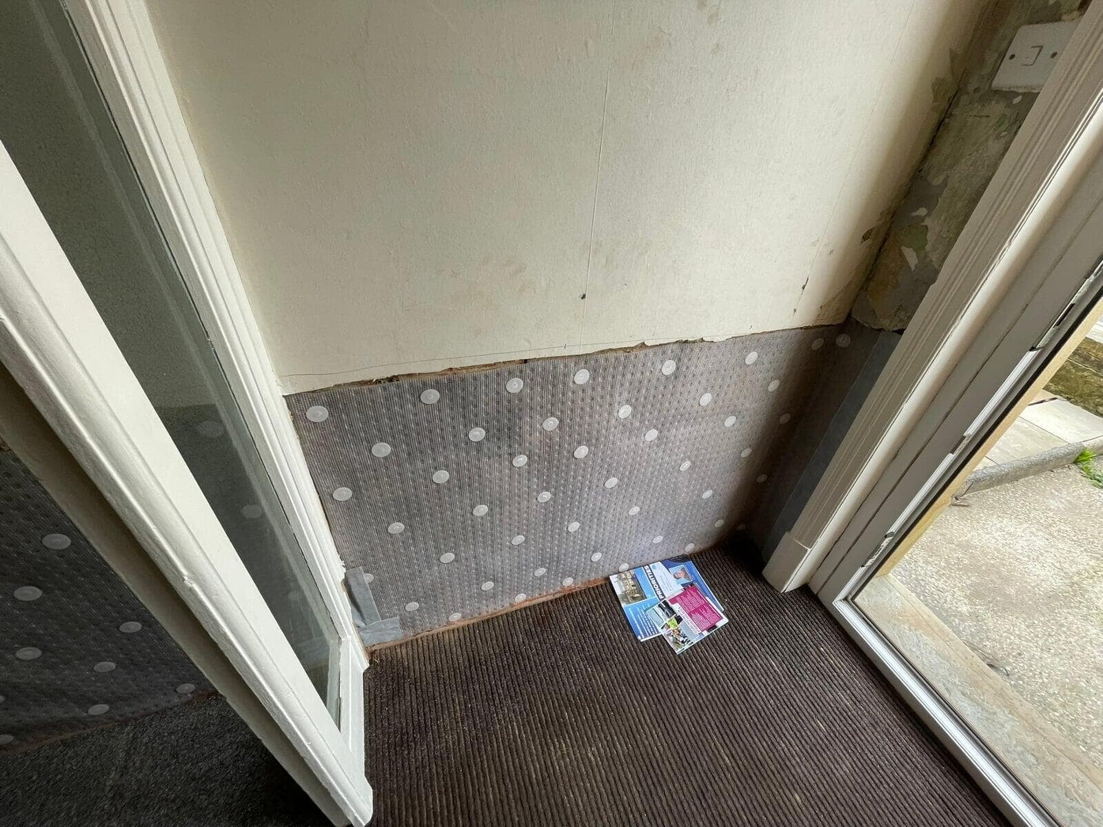Membrane fitted around a doorway during rising damp treatment, Great Harwood
