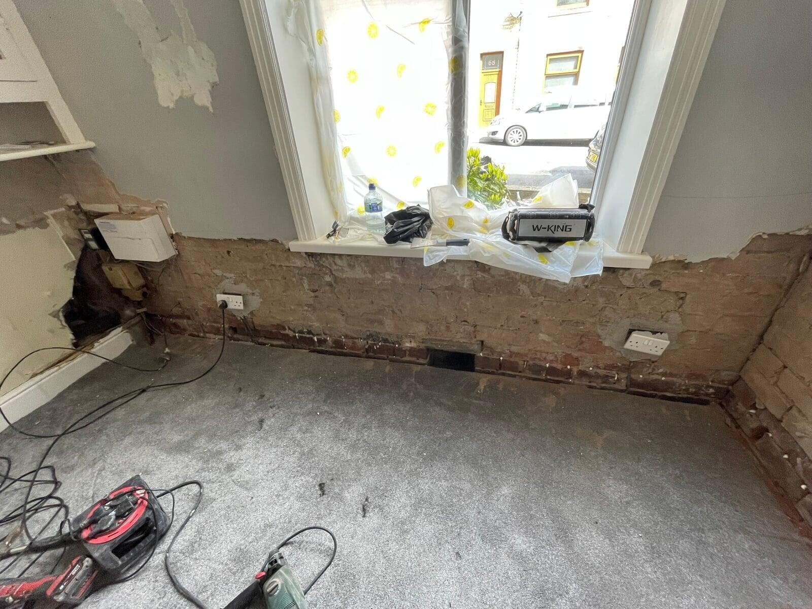 Lower wall stripped back to brick before rising damp treatment, Great Harwood